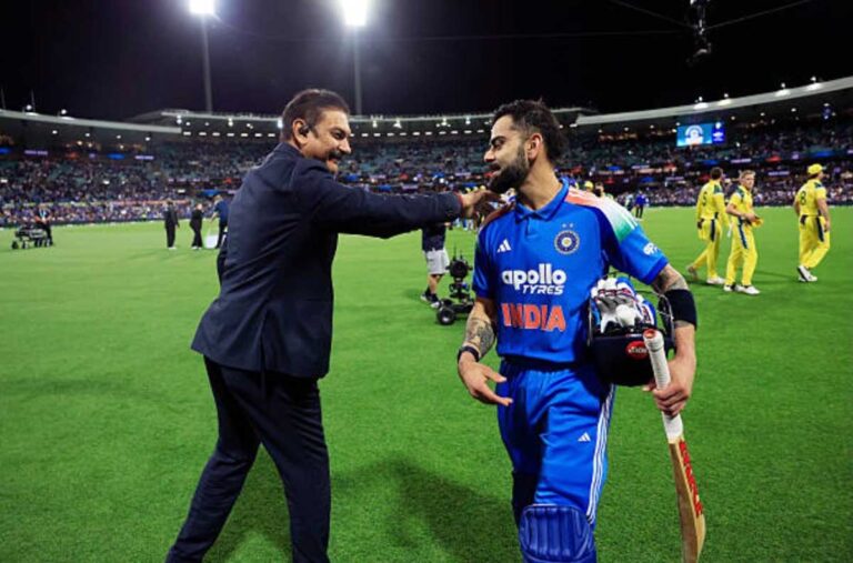 Ravi Shastri with Virat Kohli on the ground
