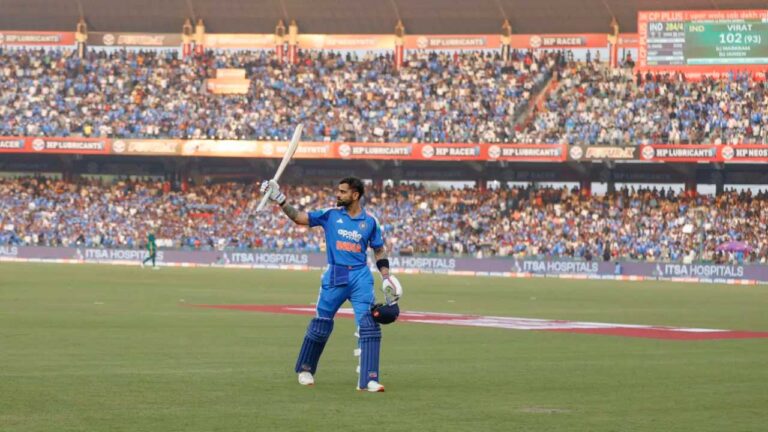 Virat Kohli walks back after making 102