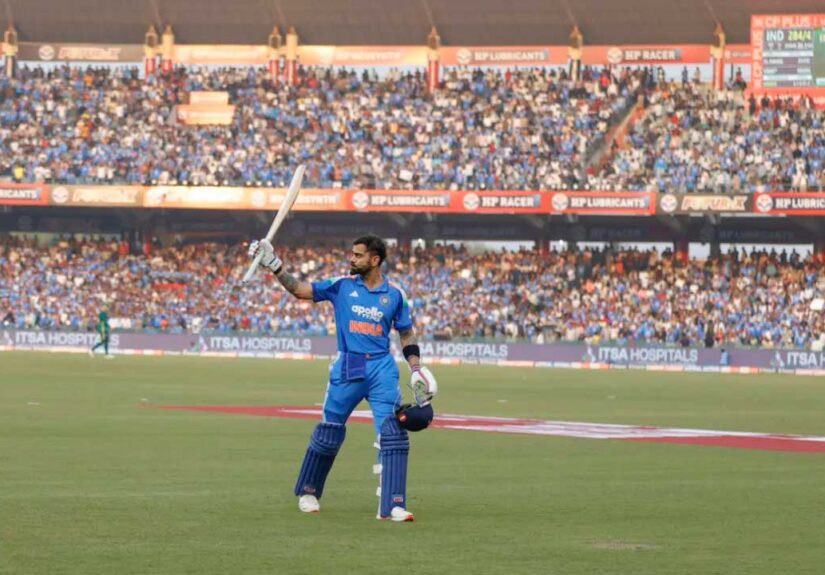 Virat Kohli walks back after making 102